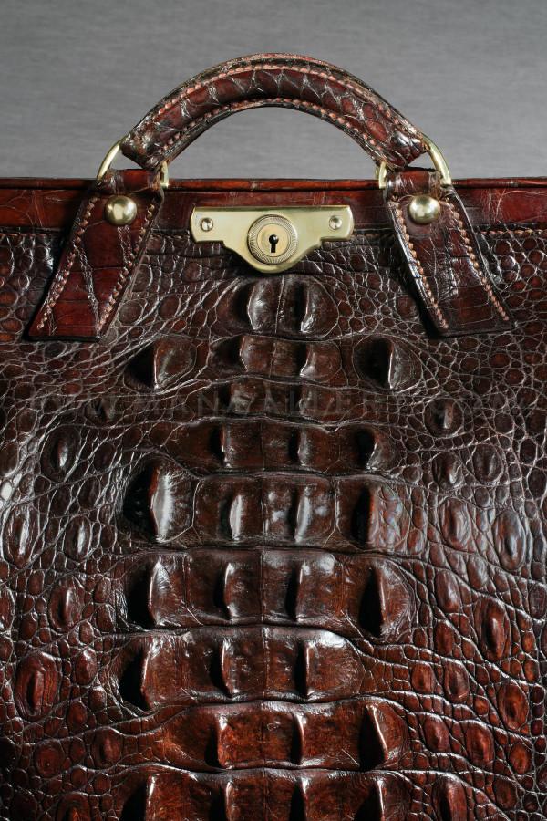 A late Victorian dark green crocodile skin Gladstone bag by Mappin  Brothers, partially fitted with f
